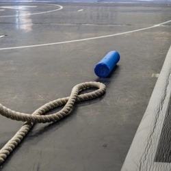 The AAHS dedicated wrestling practice area with a rope in the foreground.